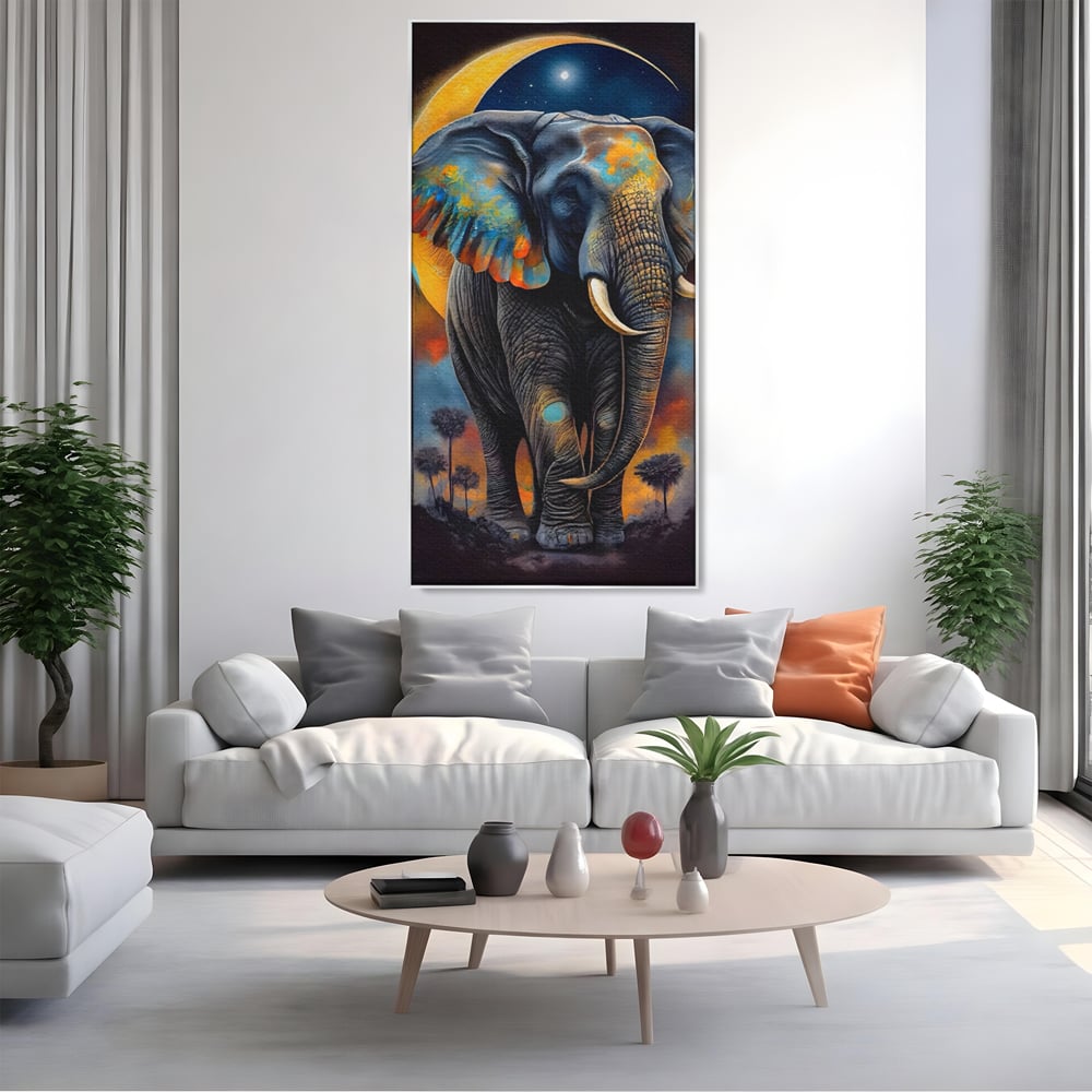 Tablou canvas cu tablou canvas cu elefant colorat si luna, in rama de aluminiu argintiu, pe perete intr-un living